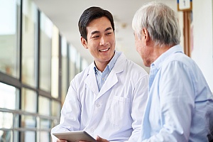 a primary care physician talking with his patient