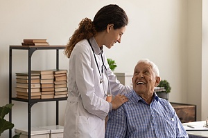 a doctor talking to an elder patient 