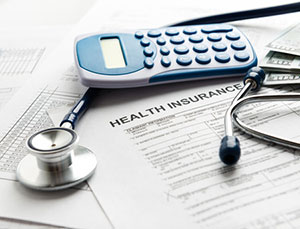 Self funding health insurance paperwork on desk