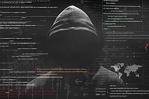 a man with a hooded jacket shown behind lines of code which show an imminent cyber attack on a small business