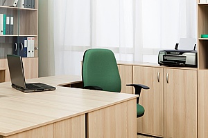 an empty desk for an individual with employee benefits who is taking leave