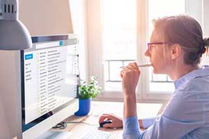 woman reading hr and compliance email from think hr