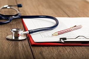 a stethoscope and health application form representing self funding