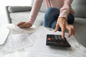 Woman calculating bill payments 