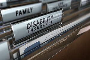 paper files with the words disability insurance on them in a file folder cabinet