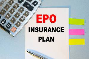 A notepad with EPO insurance plan written on it, multicolored stickers, a calculator and a pen