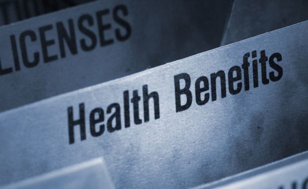 Filing folder featuring health benefits tab. Benefits renewal process involves completing a benefits renewal survey