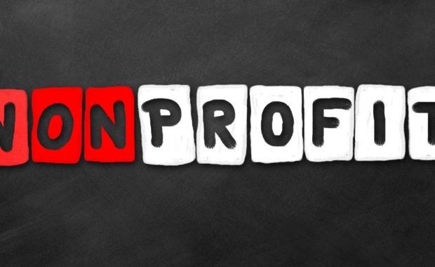 Nonprofit word on a dark background. Nonprofit organizations need directors and officers insurance