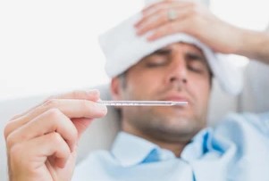 Sick Office Employee Taking Thermometer Reading