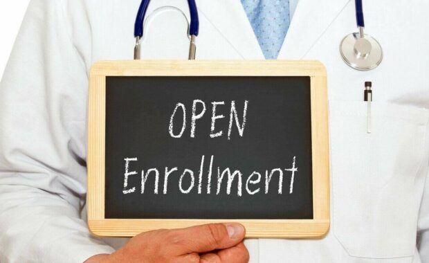 open enrollment doctor with chalkboard on white background