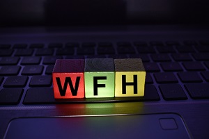 work from home on a colored wooden block on a laptop