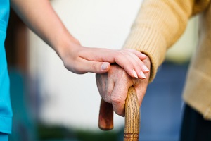 doctor holding a senior patient hand