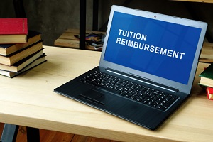 laptop with information about tuition reimbursement