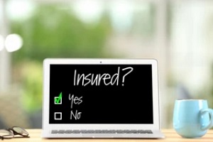 insured written on laptop with yes and no options