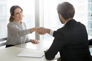 people shaking hand after contract