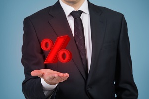 businessman holding percentage mark
