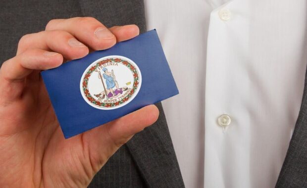 businessman is holding a business card virginia