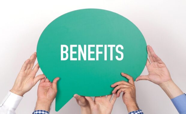 group of people holding the benefits written speech bubble