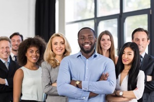 african american businessman boss with group of business people in creative office