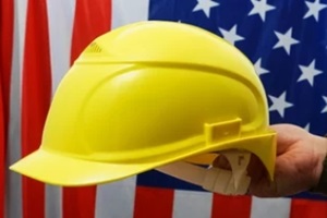 hand of engineer hold yellow plastic helmet for worker