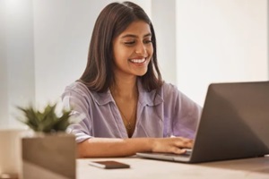 typing and business woman on laptop for research, internet connection and work at home